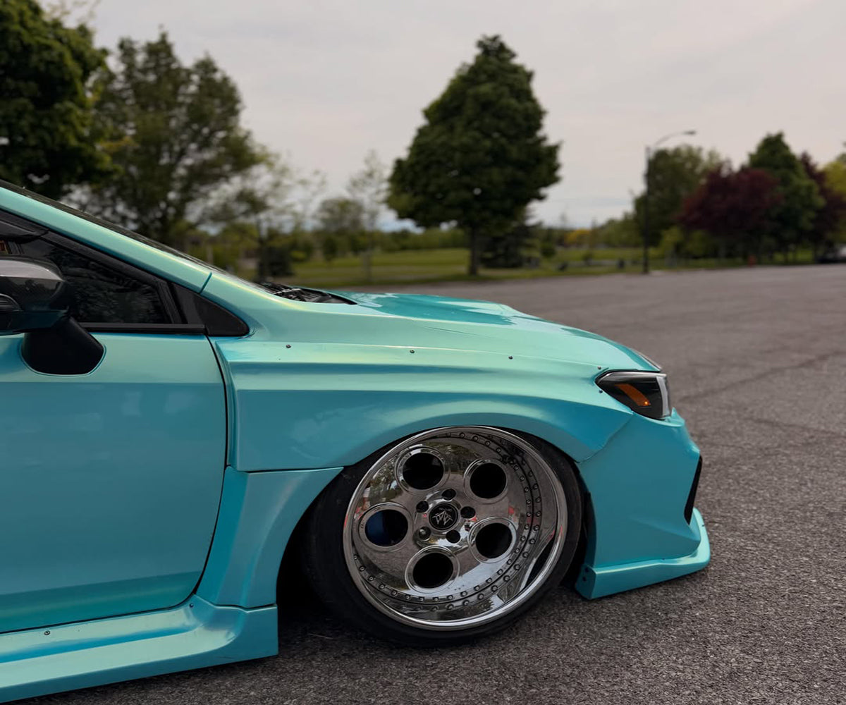 Neon Ice Blue color-shift car wrap showing blue tones in sunlight