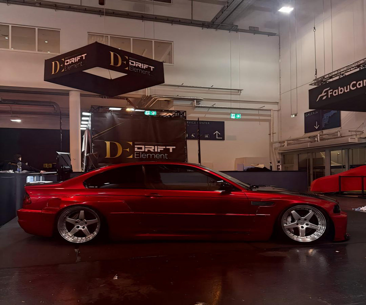 Gloss Metallic Vampire Red wrap transforming a performance car under natural light