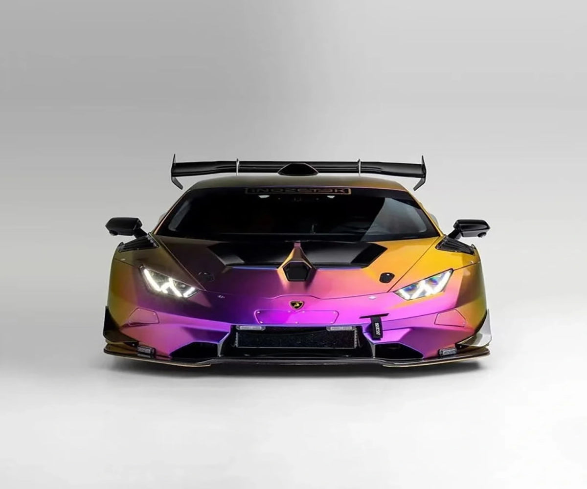 Chameleon yellow purple wrap on sports coupe shining under intense Australian sun