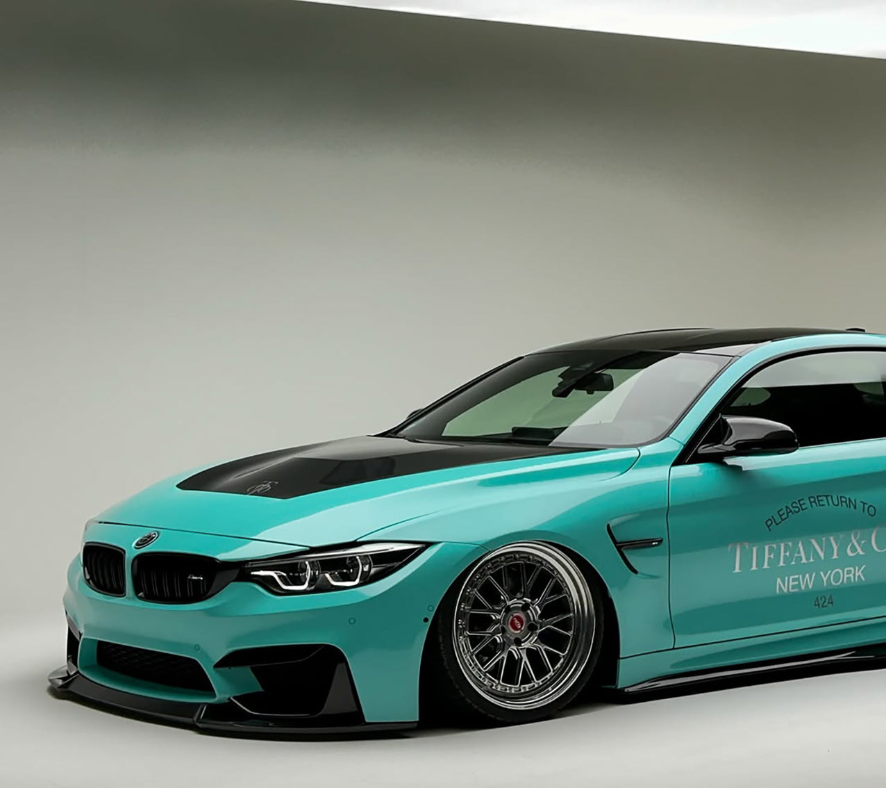 Sleek modern electric vehicle customized with a high-end pastel light blue car wrap from Aluko Car Wrap