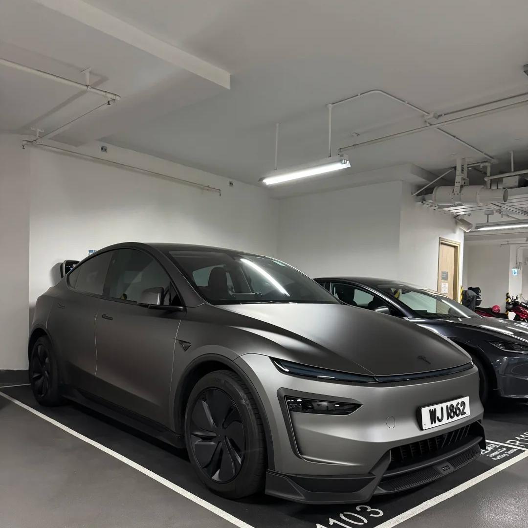 ALUKOCARWRAP Matte Metallic Dark AMG Grey Car Vinyl Wrap PET on a sports car, presenting an aggressive stealth liquid metal armor.