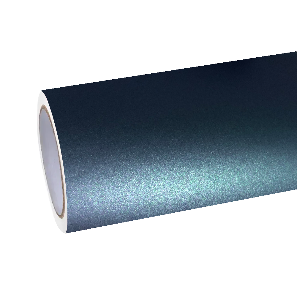 Natural sunlight striking the frosted diamond-dusted matrix of ALUKOCARWRAP aurora green car wrap film to reveal a fluid, emerald-to-teal undertone.