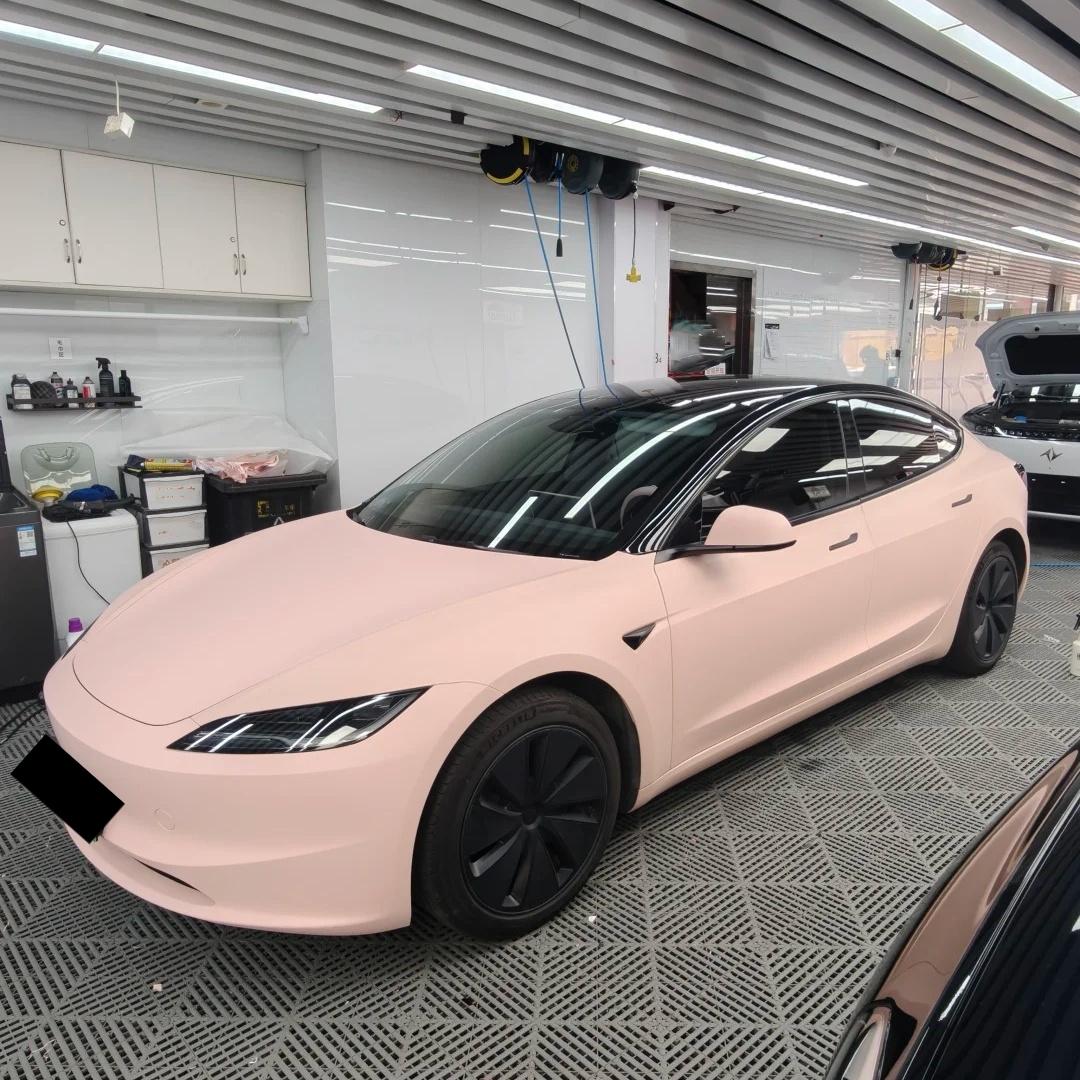Full vehicle wrap effect of Ultimate Flat Baby Pink vinyl on a luxury sports car, displaying a flawless pastel matte look.