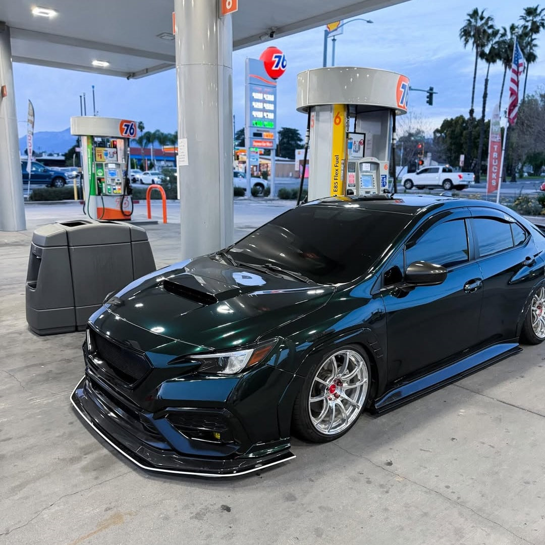 ALUKOCARWRAP gloss metallic diamond benz emerald green car vinyl wrap on a sport luxury coupe, catching sunlight to show rich metallic flakes and zero-orange-peel PET finish.