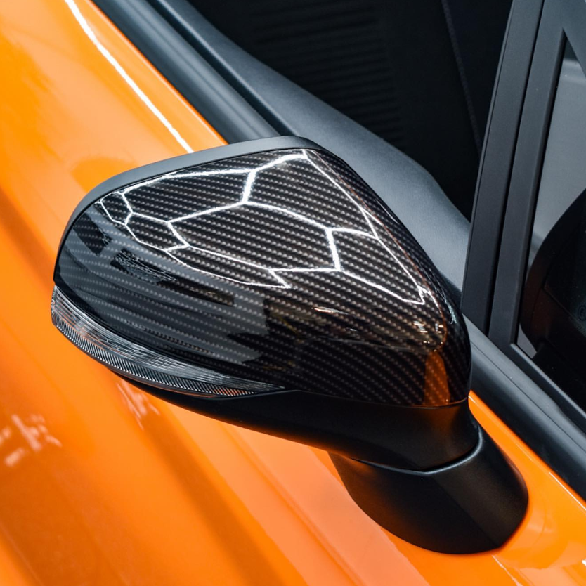 A sports car hood customized with 4D Gloss Black Carbon Fiber Car Vinyl Wrap, delivering a realistic hypercar weave look.