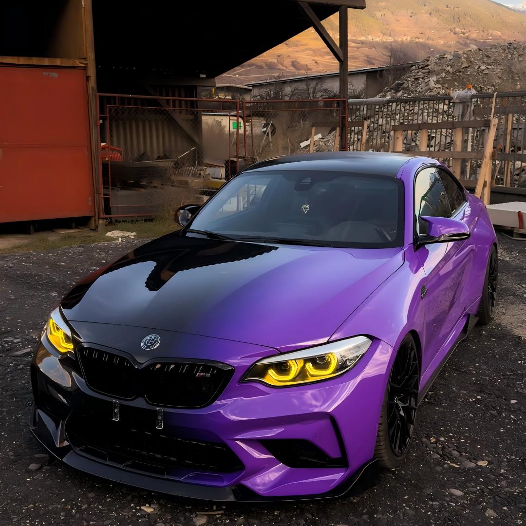 Full vehicle color change with ALUKOVINYL black to purple gradient custom vinyl wrap on a sedan.