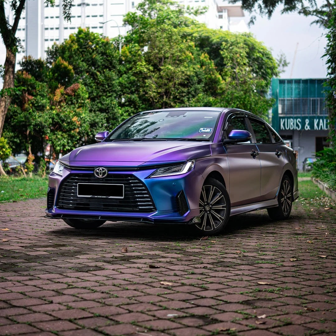 Side angle of Chameleon Blue Car Wrap changing to Chameleon Purple Car Wrap under natural sunlight, highlighting the premium automotive dual-tone styling.