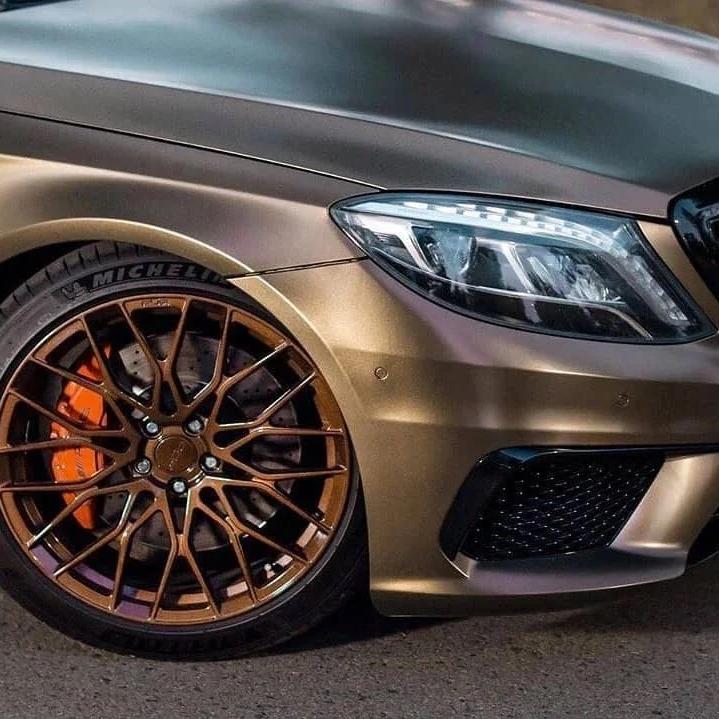 Silk-textured liquid metal shadows on a luxury SUV panel wrapped in Satin Chrome Gold Brown Car Vinyl Wrap material.