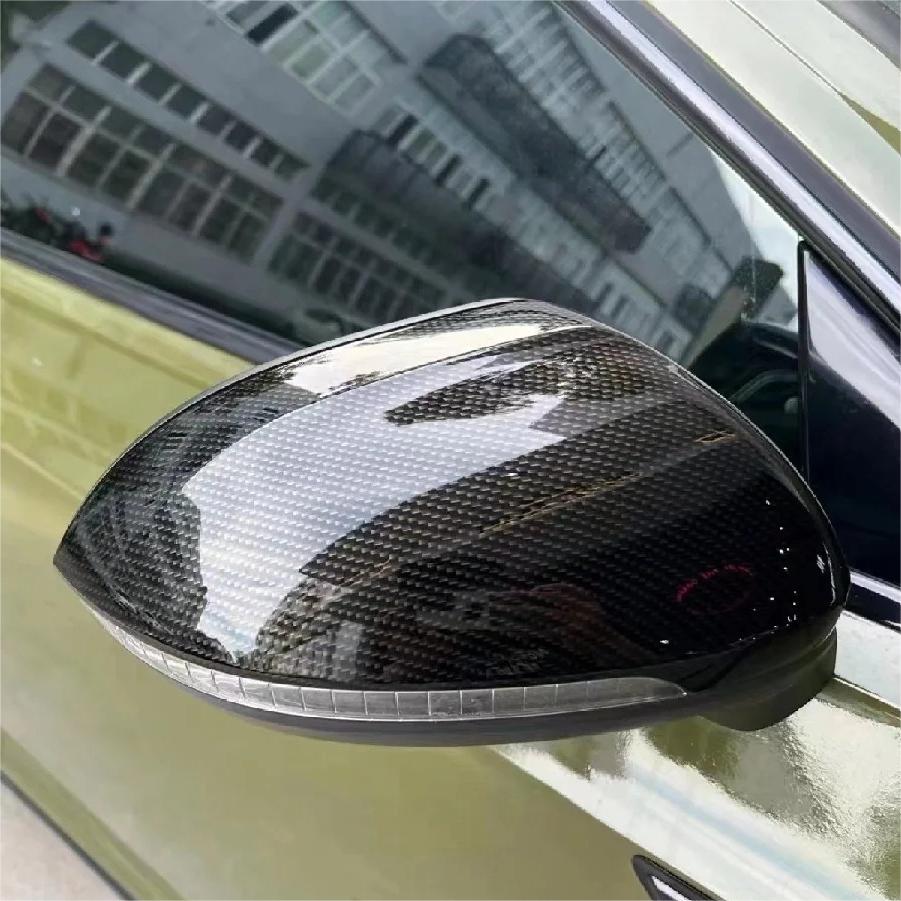 Sleek side mirror covers detailed with ALUKOCARWRAP gloss black wrap, capturing the flawless high-gloss racing look on intricate automotive curves.