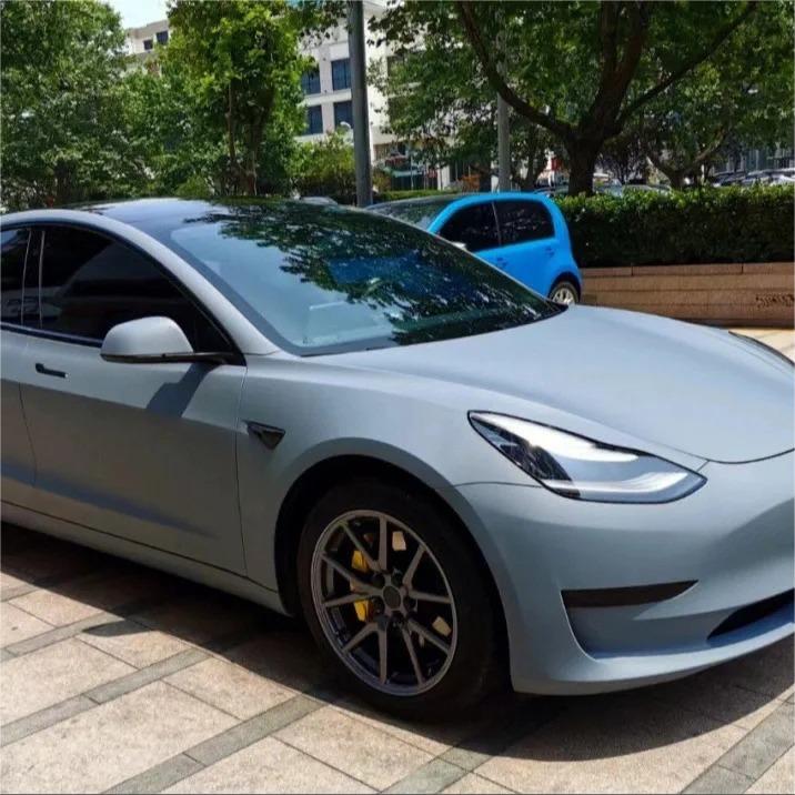 A solid, battleship-inspired architectural stance on a luxury sports car wrapped in ALUKOCARWRAP satin grey car wrap, showcasing flat non-glare industrial armor.