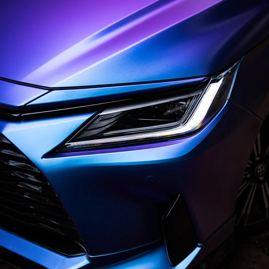Close-up shot of ALUKOCARWRAP Matte Chameleon Car Wrap showcasing the flawless satin texture and bubble-free vinyl film edge on a vehicle fender.