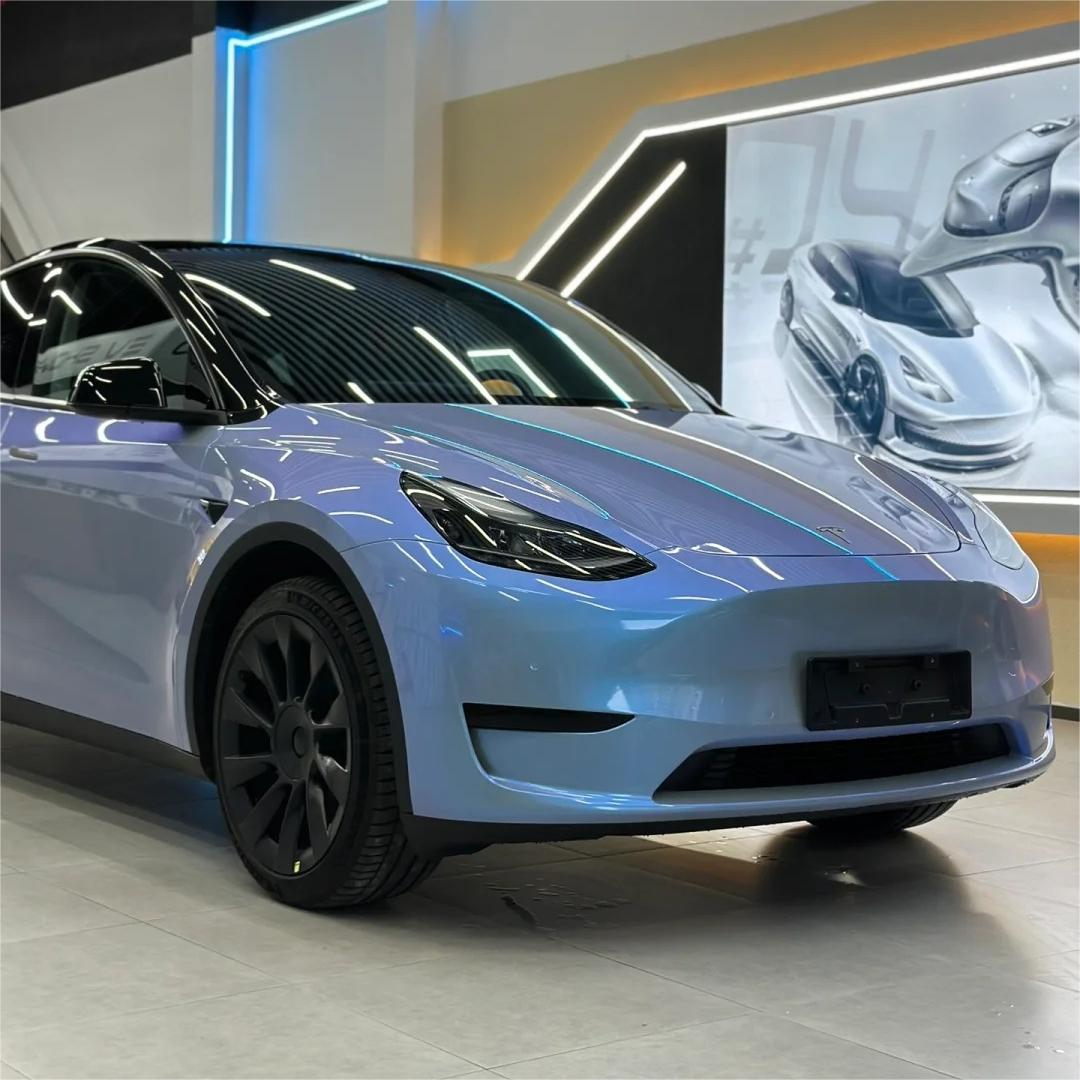 A sharp front-quarter shot capturing a vehicle's body lines with Chameleon Grey Car Wrap, showing how light shifts seamlessly over aggressive fender creases.