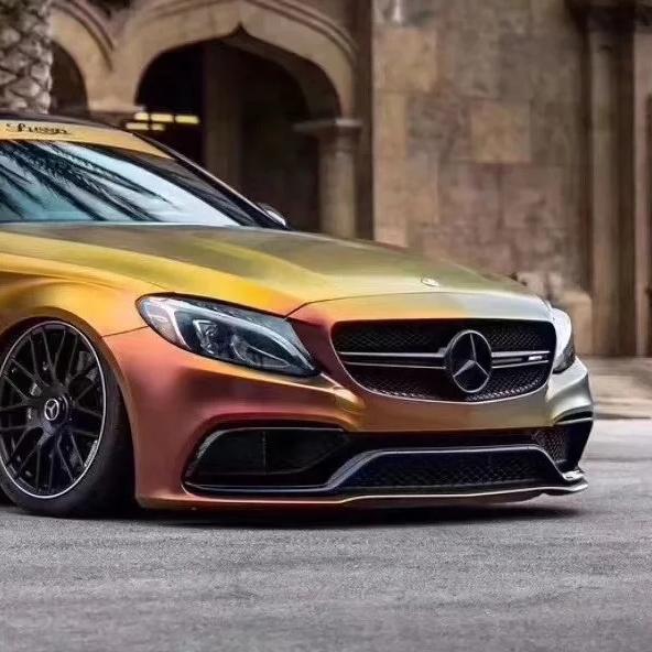 Side angle of Chameleon Gold Car Wrap from ALUKOCARWRAP, demonstrating how the red and gold tones transition along body lines.