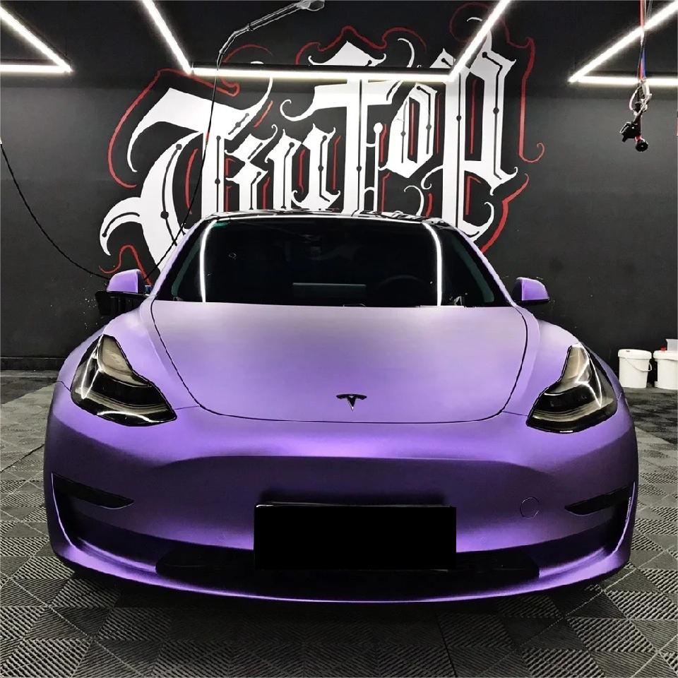 Exotic vehicle featuring an aggressive upgrade via chrome purple car wrap film, reflecting a unique metallic purple car wrap sheen under natural light.