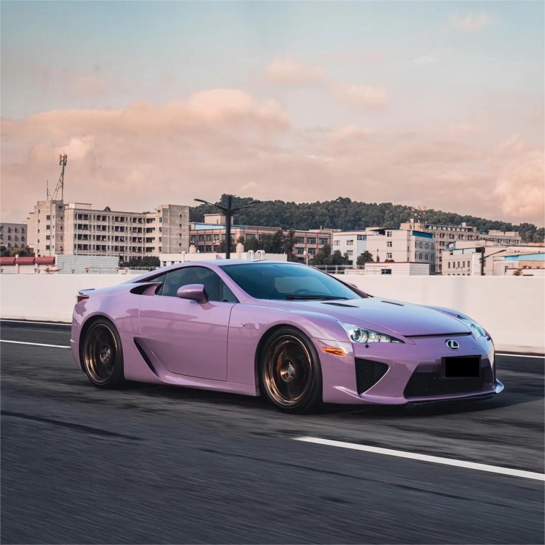 Vibrant Gloss Purple Car Wrap film from ALUKOCARWRAP, demonstrating how the subtle metallic crystal flakes sparkle in open daylight.
