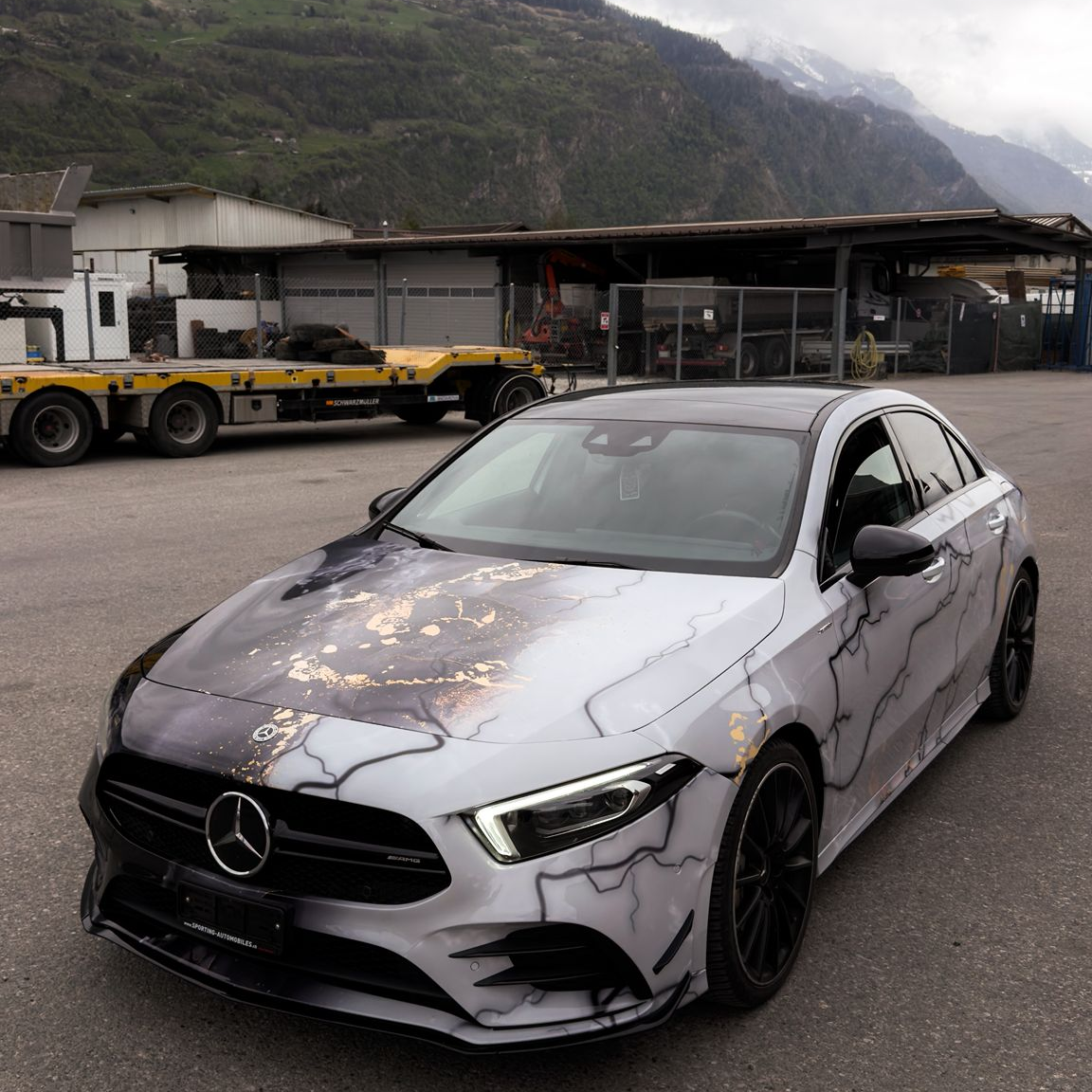 Full vehicle wrap with ALUKOVINYL marble vinyl wrap, transforming sedan into white car wraps style.