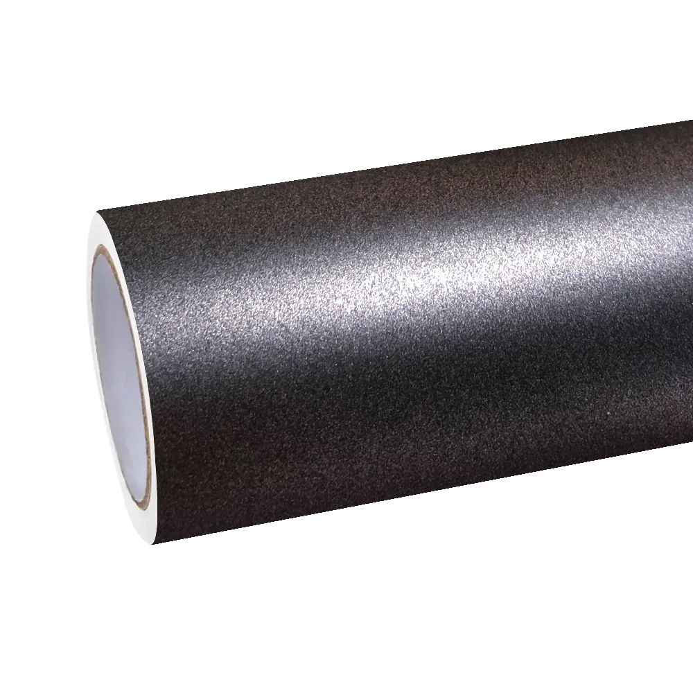 Industrial studio shot of an unrolled ALUKOCARWRAP matte grey wrap material roll, displaying the zero orange-peel perfection of the flexible PET backing.
