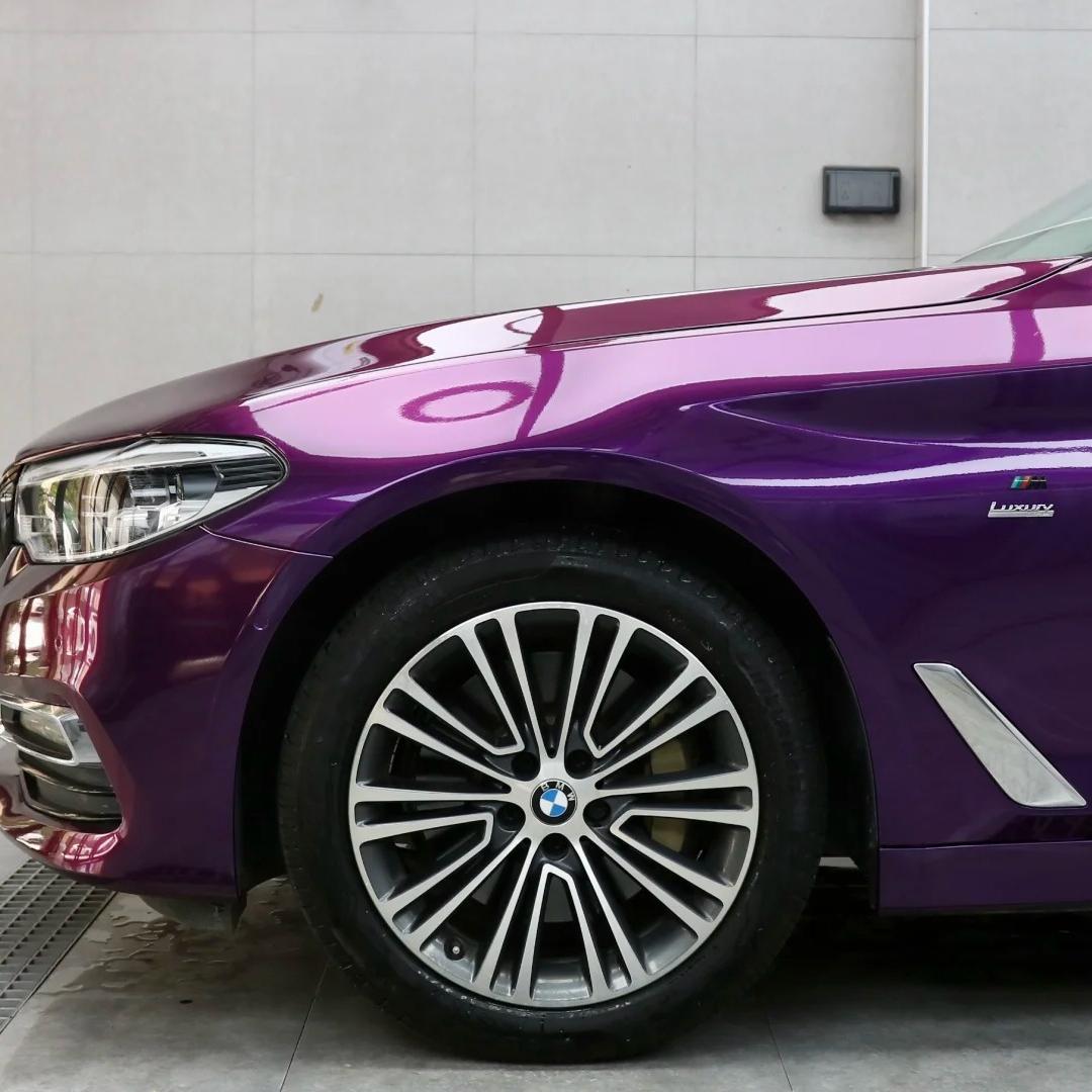 Close-up of Gloss Ideal Dark Purple Car Vinyl Wrap by ALUKOCARWRAP, featuring advanced bubble-free technology.