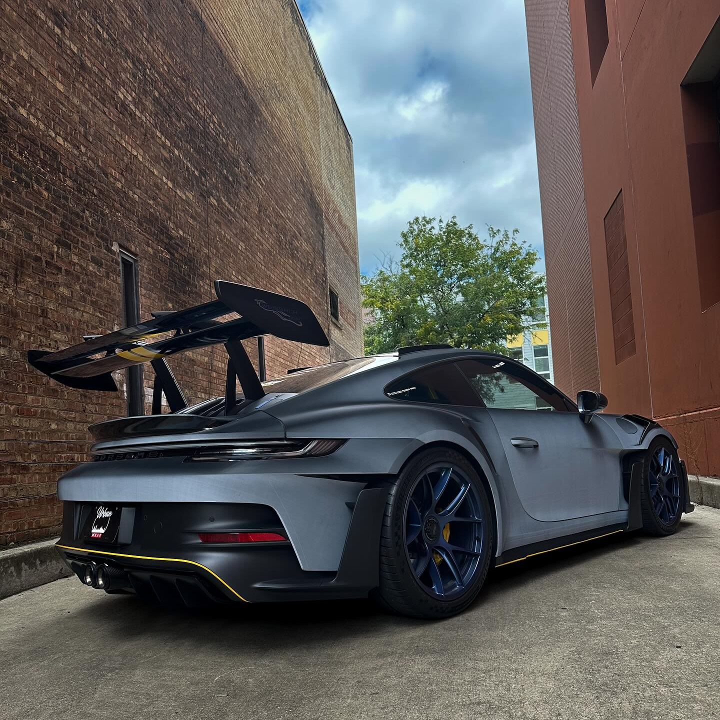 ALUKOCARWRAP TPU Car Wrap on a supercar, exhibiting a dynamic white-to-black color shift with cosmic optical reflections.
