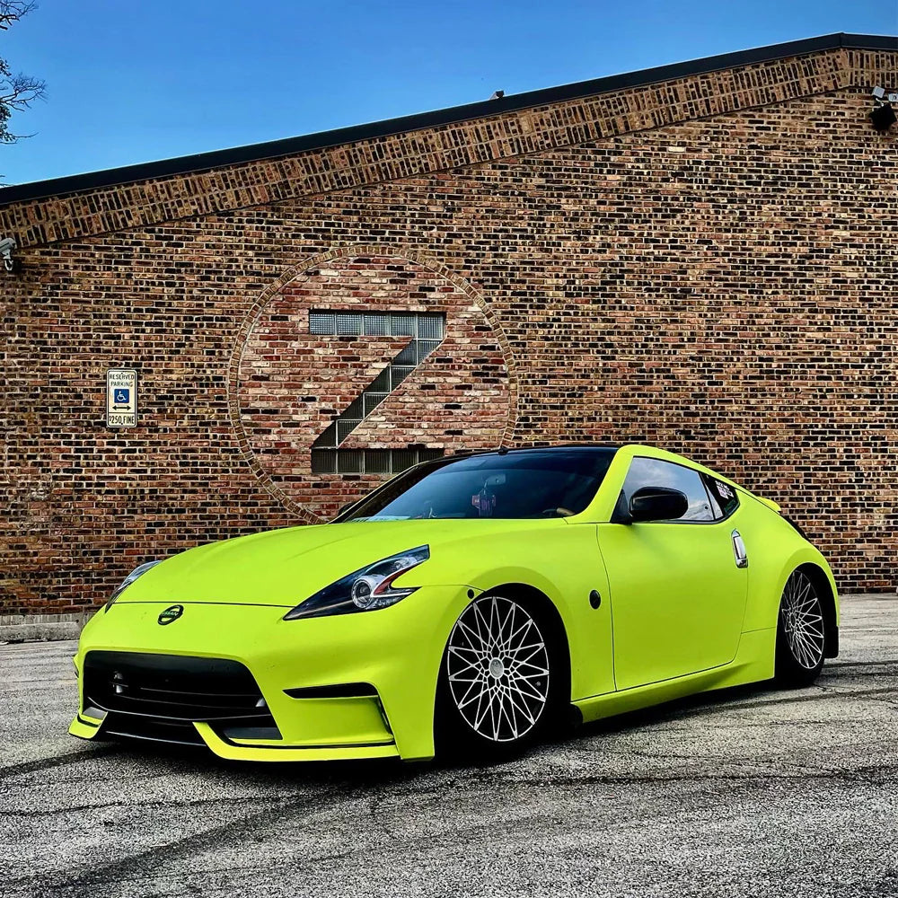 Close-up view of ALUKOCARWRAP Matte Ultimate Flat Fluorescent Yellow Car Vinyl Wrap PET highlighting neon finish and details