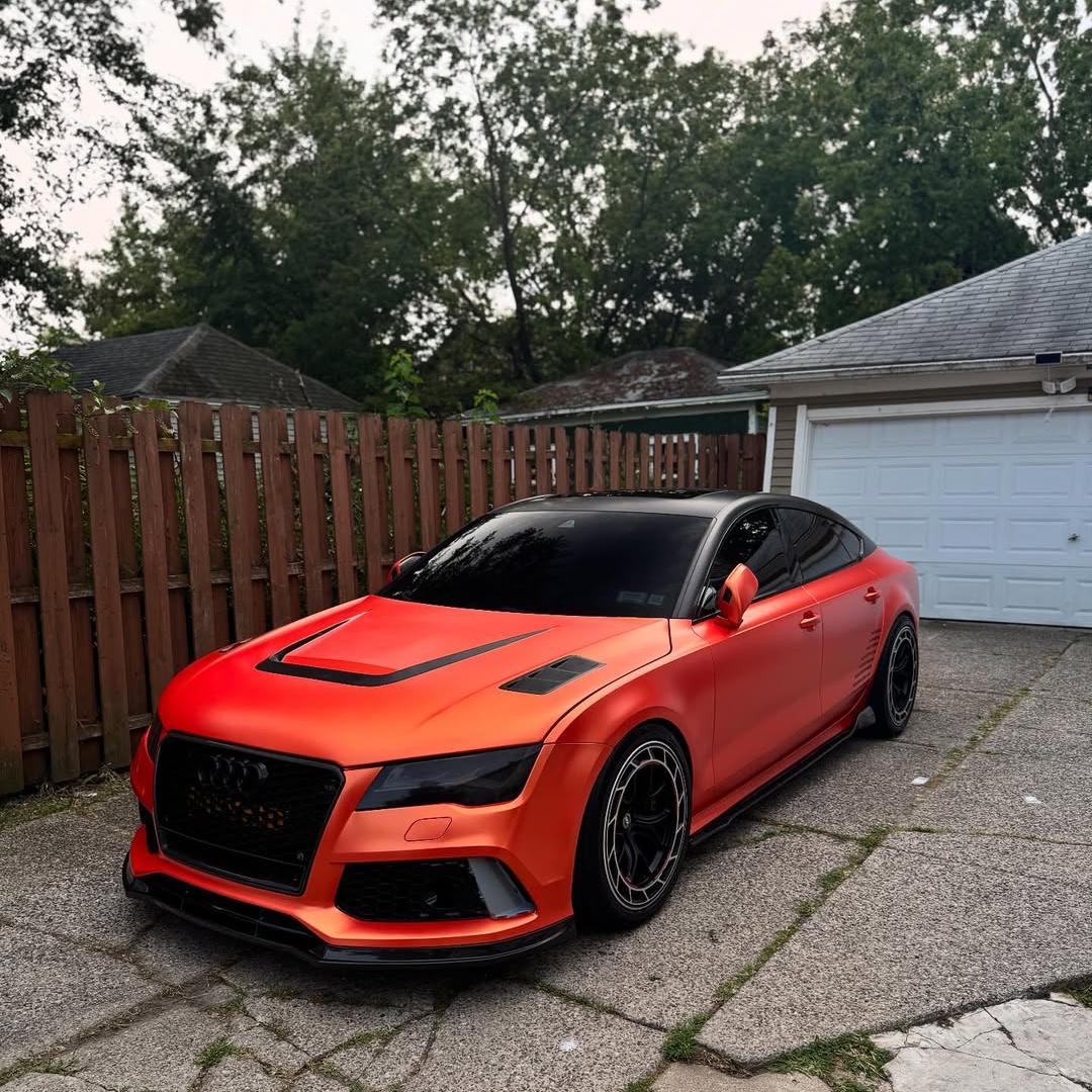 Front fascia detail of ALUKOCARWRAP Ultimate Flat Matte Metallic Stunning Orange Car Vinyl Wrap PET highlighting smooth PET backing texture