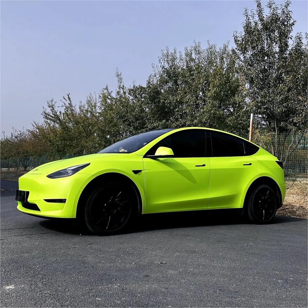 Side profile of car wrapped in ALUKOCARWRAP Matte Ultimate Flat Fluorescent Yellow Car Vinyl Wrap PET with high-visibility finish