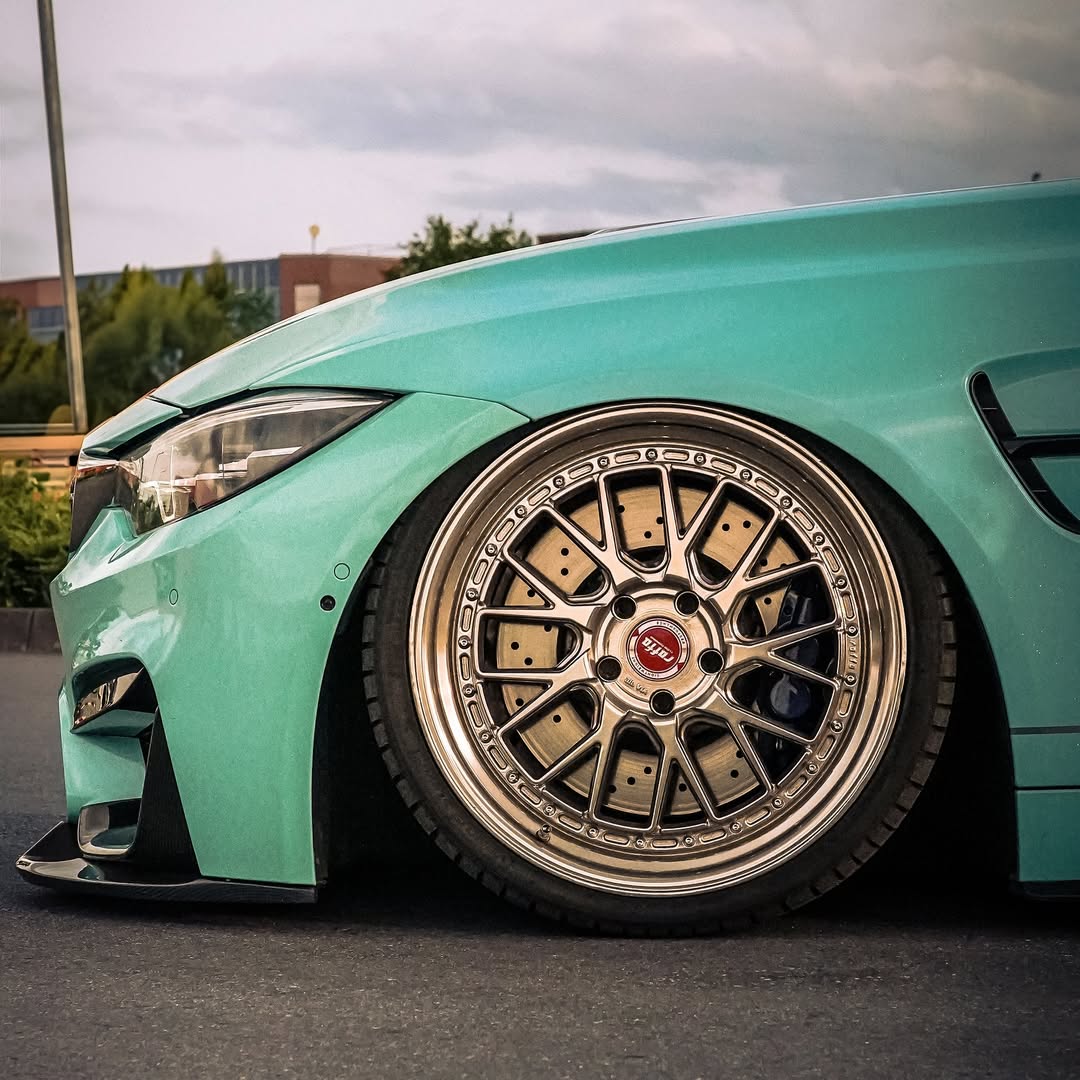 Sunlight reflection on shimmering metallic flakes of Gloss Sparkle Glitter Tiffany Blue Car Vinyl Wrap material.