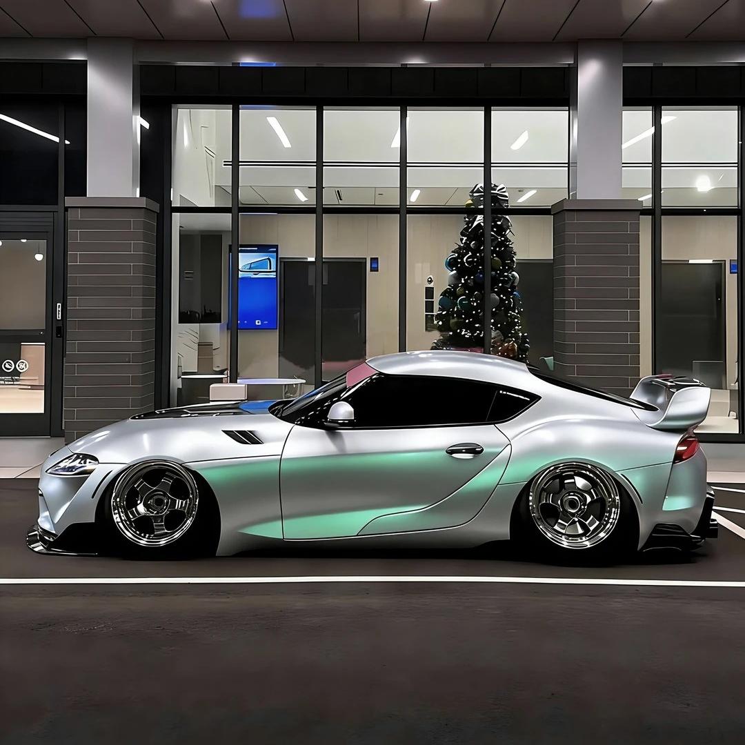 A customized luxury vehicle sporting a dynamic silver green car wrap with a deep gloss metallic hyper-reflective color change.