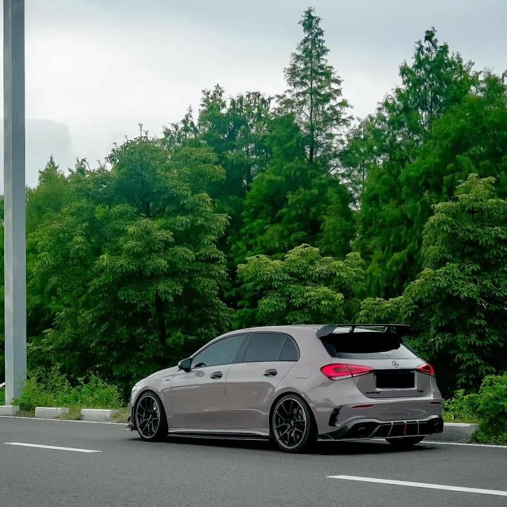 Full vehicle wrap transformation featuring ALUKOCARWRAP grey car wrap in Gloss Dove Grey PET, delivering a striking modern concrete style for daily driving.