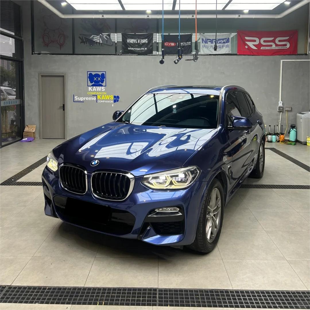 Deep ocean galaxy blue car wrap capturing microscopic metallic flakes under crisp studio lighting conditions.