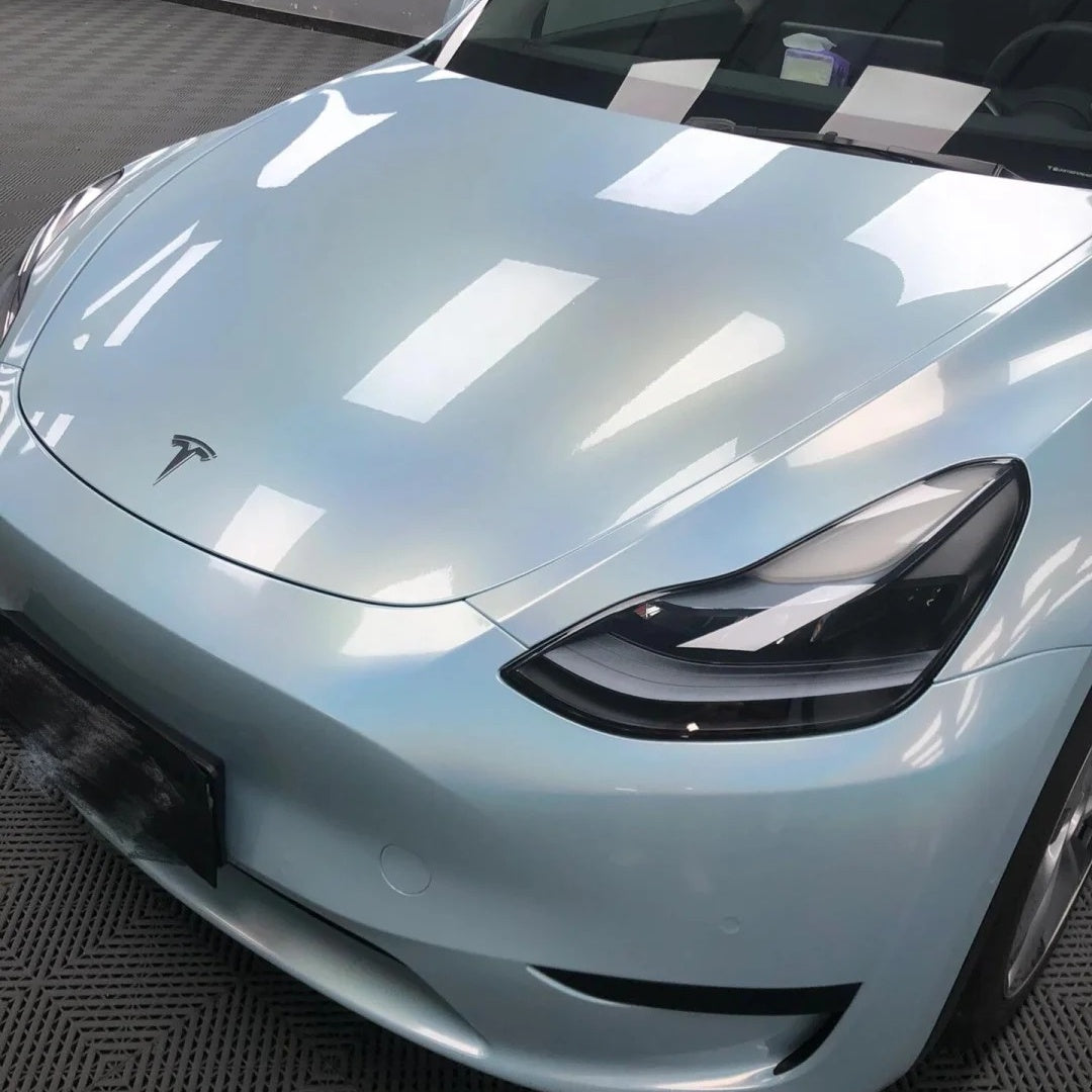 Macro detail of car body contours featuring ALUKOCARWRAP Gloss Metallic Car Wrap, highlighting a flawless Gloss Blue Car Wrap finish with zero orange peel.