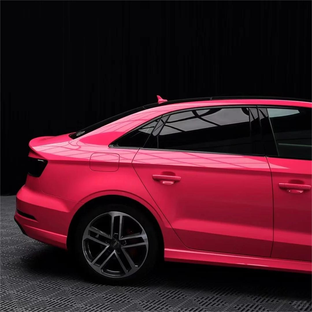 Close-up of ALUKOCARWRAP Gloss Pink Car Wrap, highlighting the crystal-clear reflection with zero orange peel texture.