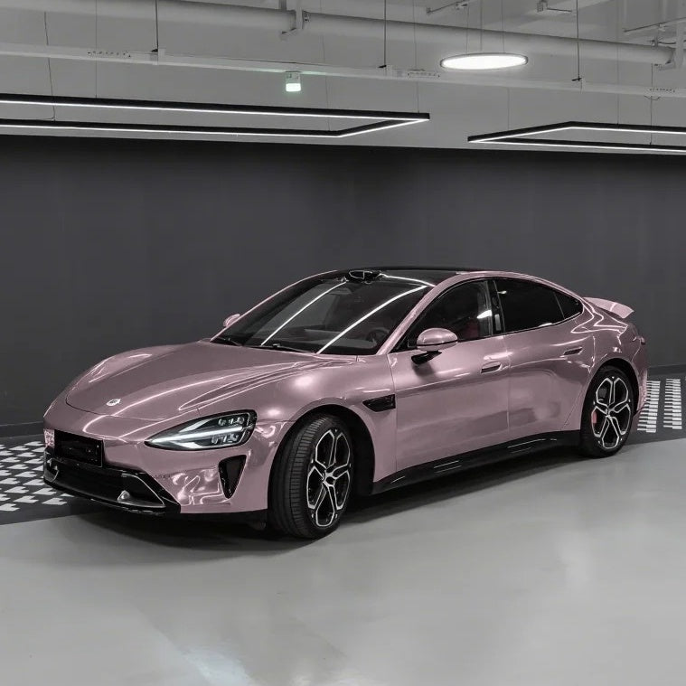 Elite sedan completely transformed in ALIKOCARWRAP taupe pink car wrap PET, revealing an elegant gender-neutral contour.