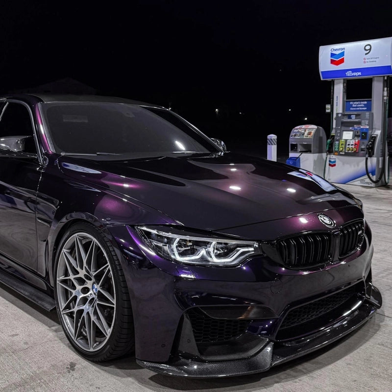Close-up of metallic ghost midnight purple vinyl wrap PET on sportscar, showcasing metallic purple vinyl wrap gloss and flake.