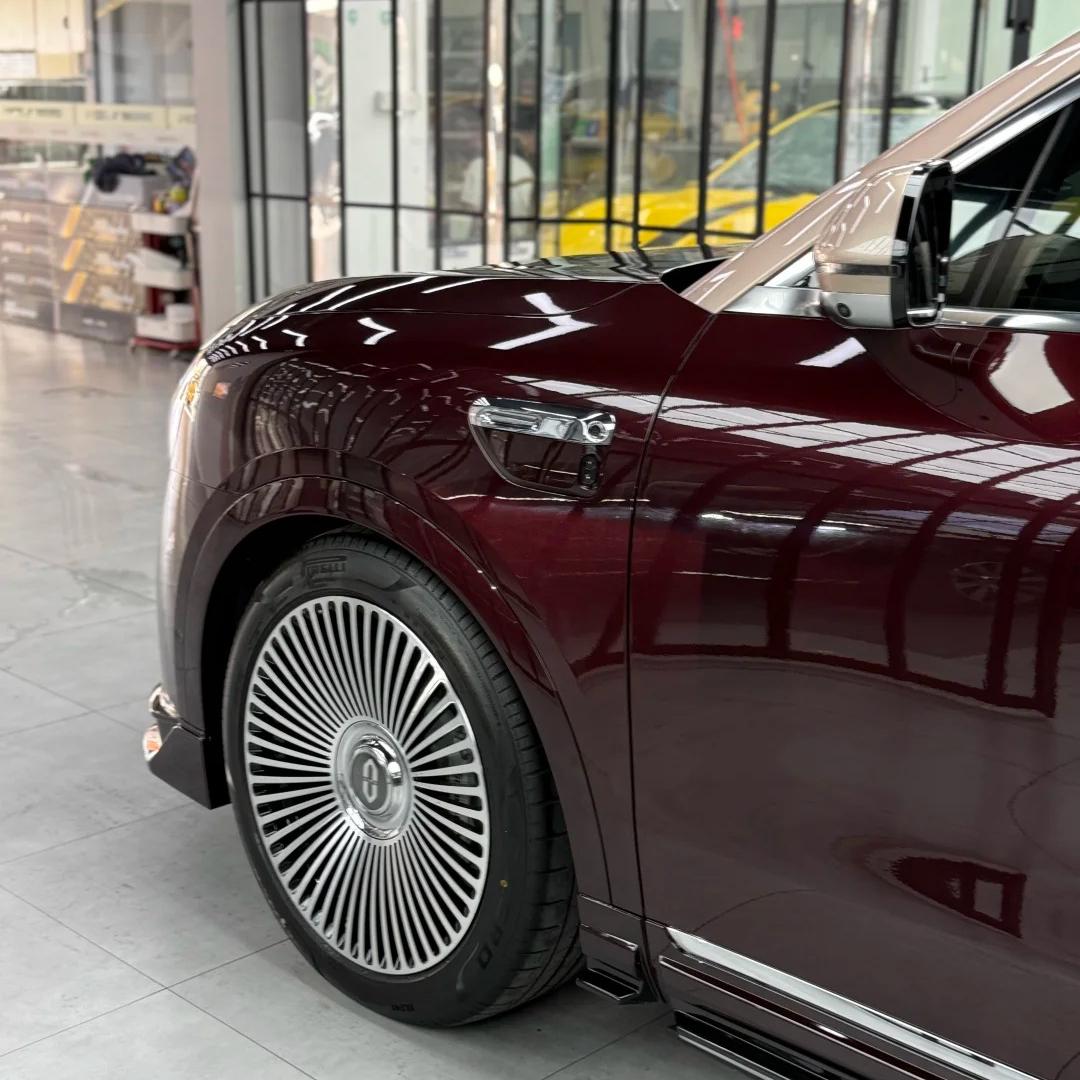 Micro view of sharp vehicle panel lines with ALUKOCARWRAP Metallic Red Car Wrap, capturing the flawless mirror-like Gloss Red Car Wrap metallic flake reflection.