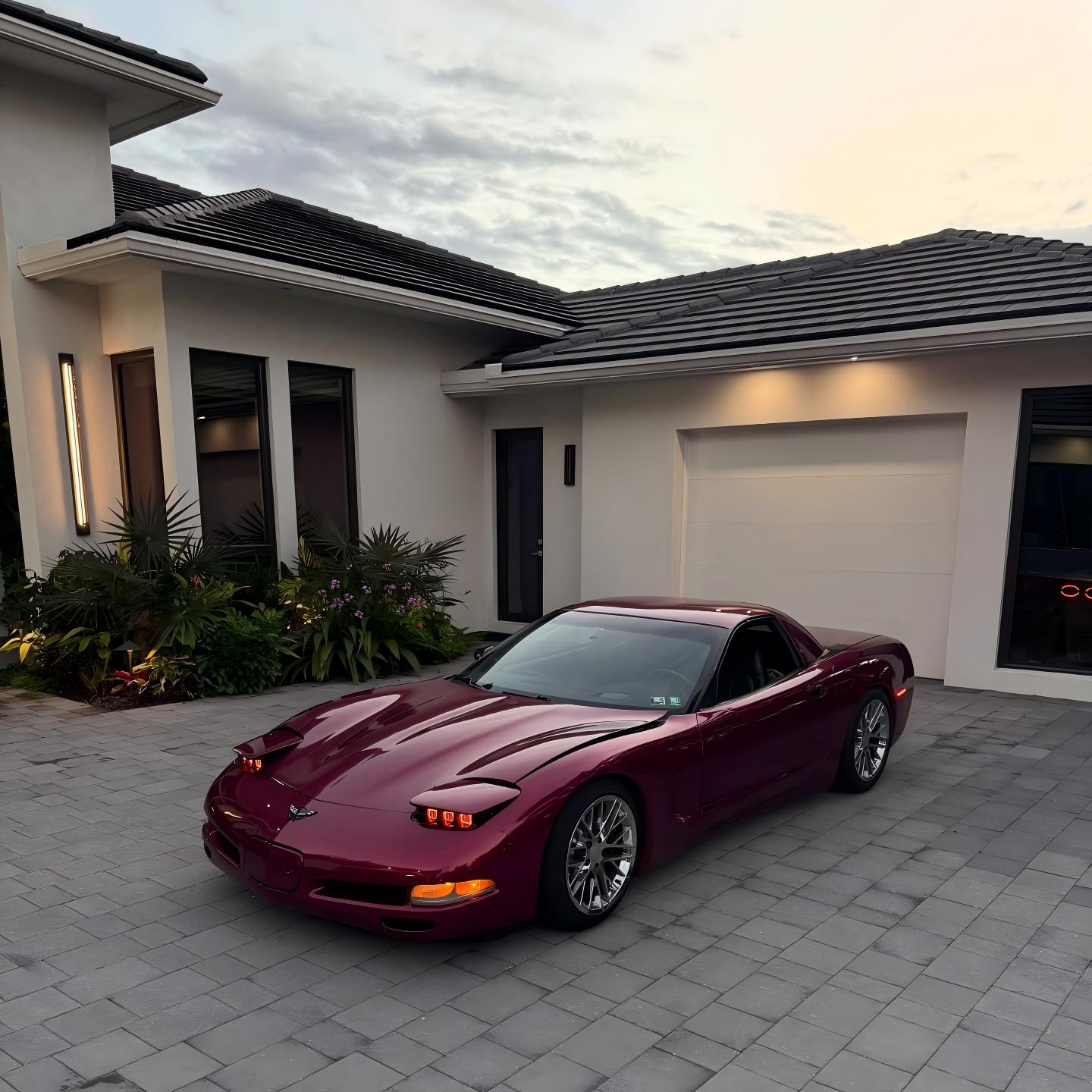 ALUKOCARWRAP Gloss Metallic Pagoda Red Car Vinyl Wrap PET on a sports car, showing rich liquid enamel crimson brilliance.