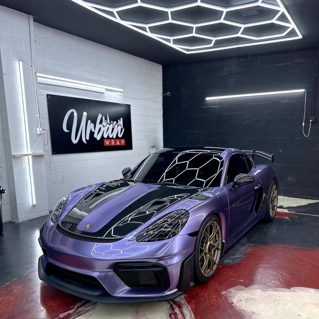 Luxury car wrapped in ALUKOCARWRAP Gloss Metallic Viola Purple Vinyl Wrap PET, premium car wrapping look in outdoor sunlight.
