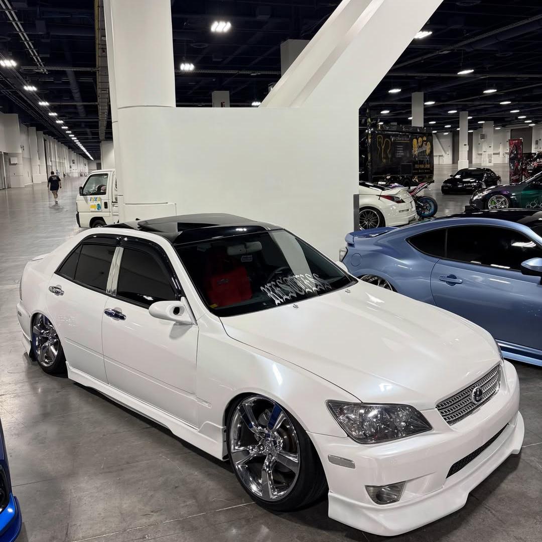 Glossy white car wrap showing clear light reflections across a smooth white surface
