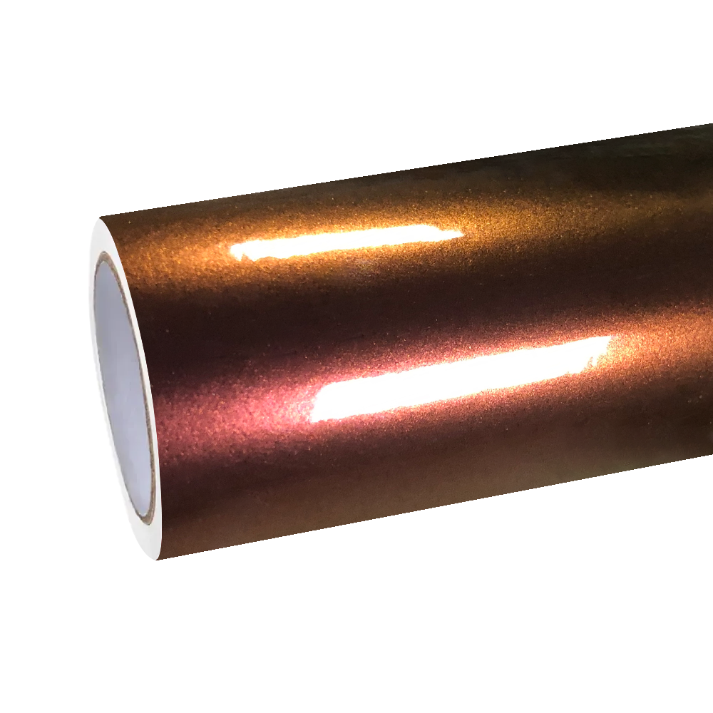 Close-up of a roll of ALUKOCARWRAP Gloss Chameleon Car Wrap, showcasing the glossy iridescent film transitioning from a radiant golden hue into a fiery crimson under studio lighting.