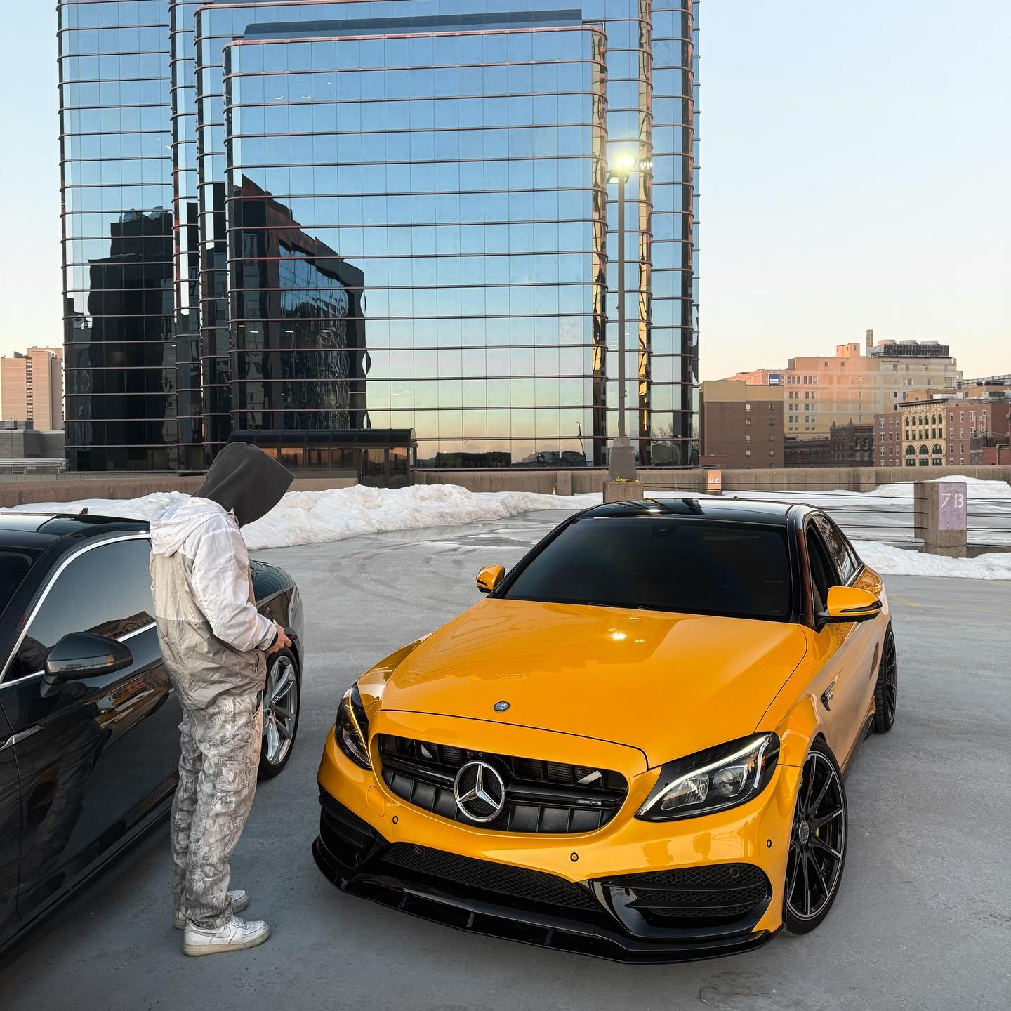 Close-up of gloss metallic car wrap PET by ALUKOCARWRAP, capturing high-refractive metallic yellow car wrap crystal flakes.