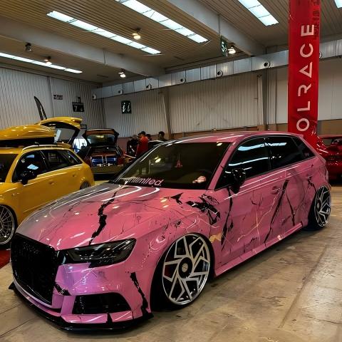 ALUKOCARWRAP pink to gray car wrap on a luxury sedan, showcasing a seamless gradient transition and custom marble veins.