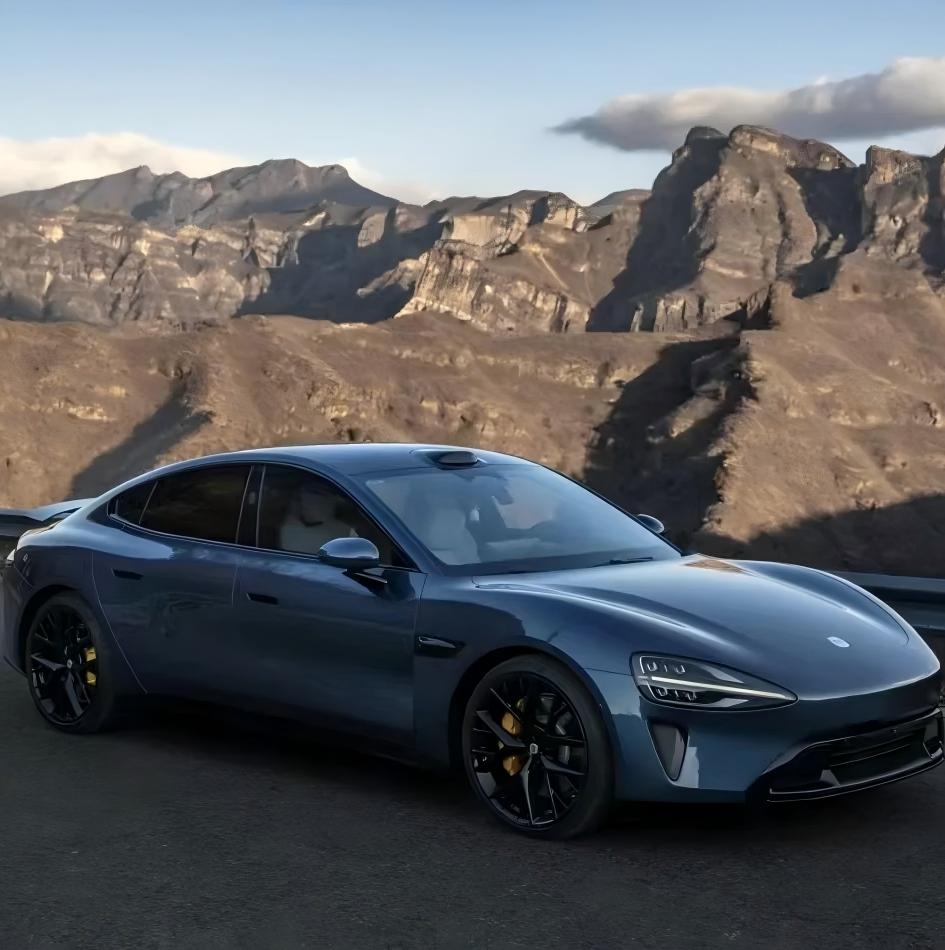 Sunlight reflecting off a premium Grey Blue Car Wrap surface to reveal intense blue metallic micro-particles.