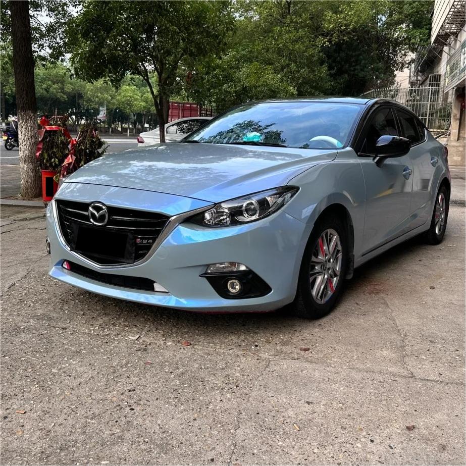 A razor-sharp, high-gloss silhouette on a luxury sports car wrapped in ALUKOCARWRAP gloss metallic car wrap, shifting from silver-grey to a rich metallic blue car wrap depth under daylight.