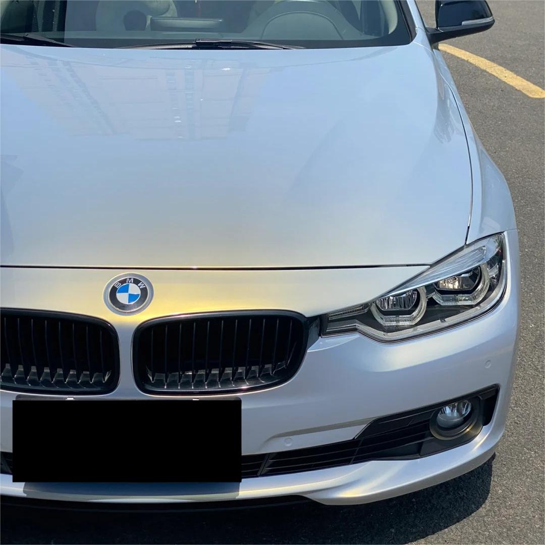 Sharp automotive muscular lines capturing a flawless, crease-free installation of ALUKOCARWRAP diamond grey car wrap with a deep, non-orange-peel metallic grey gold tone.