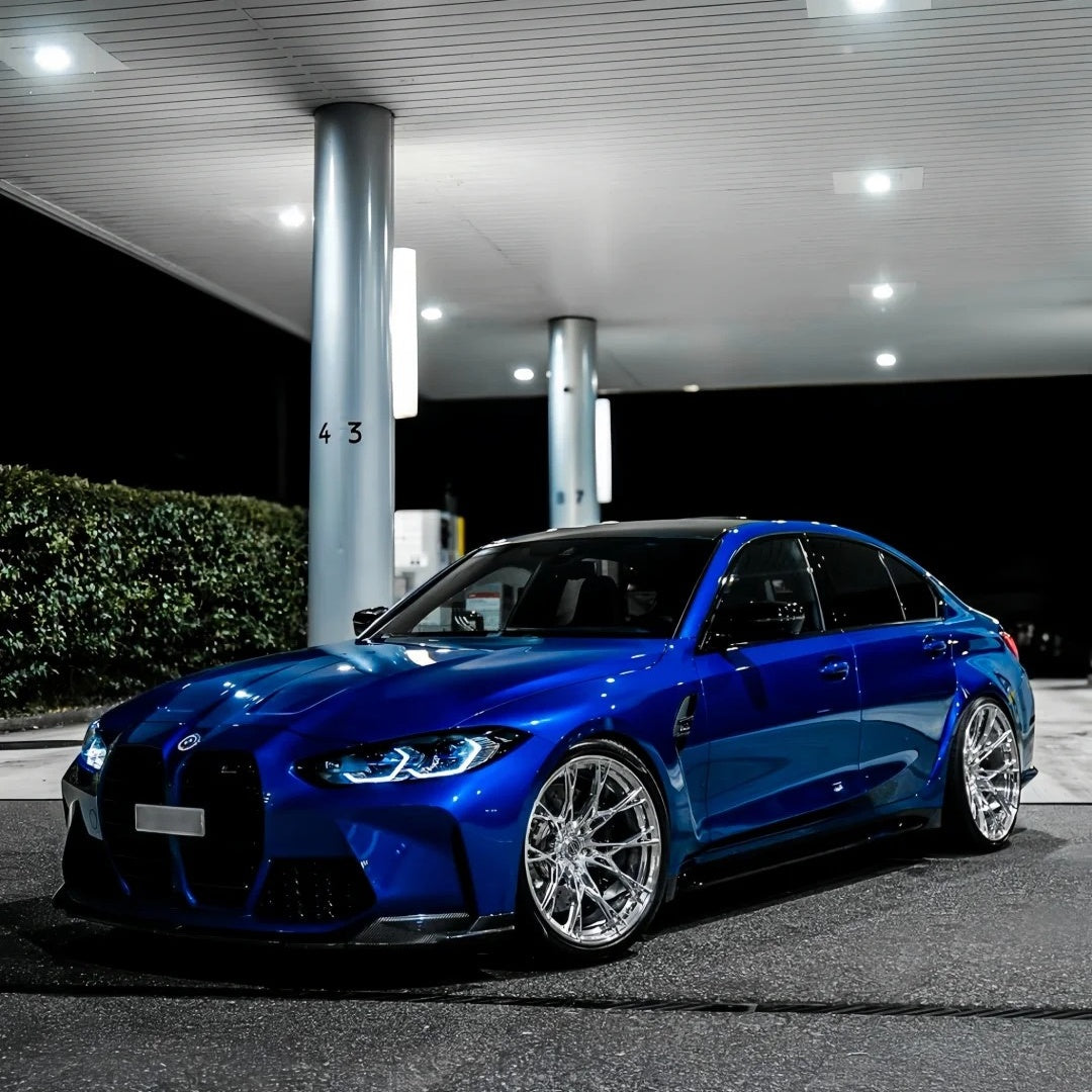 Electric gloss blue car wrap by ALUKOCARWRAP on a vehicle, presenting a premium dark blue car wrap aesthetic.