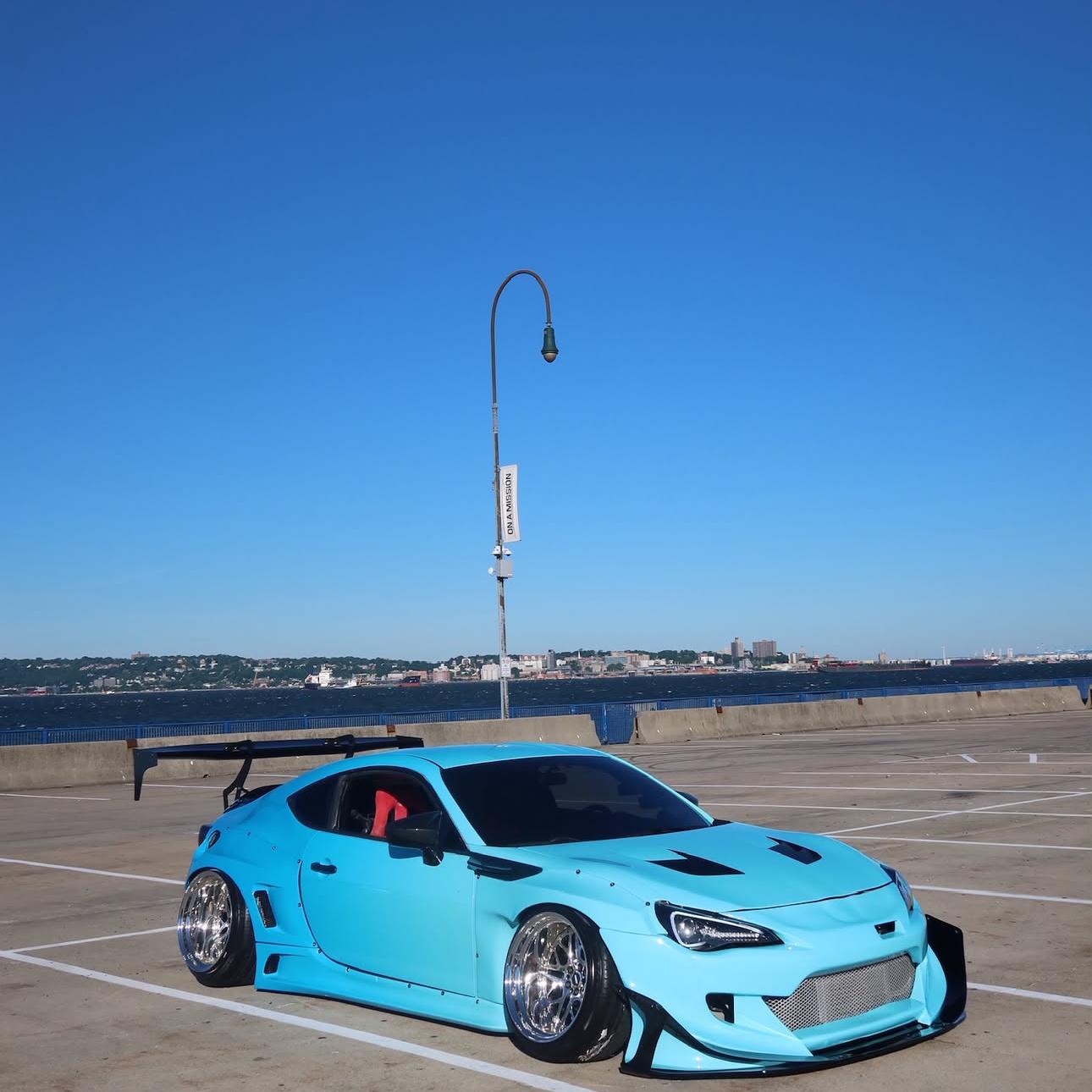 ALUKOCARWRAP Light Blue to Dark Blue Gradient Custom Car Wraps on a Subaru BRZ, showcasing a fluid, high-resolution color fade without visible dot matrixing.