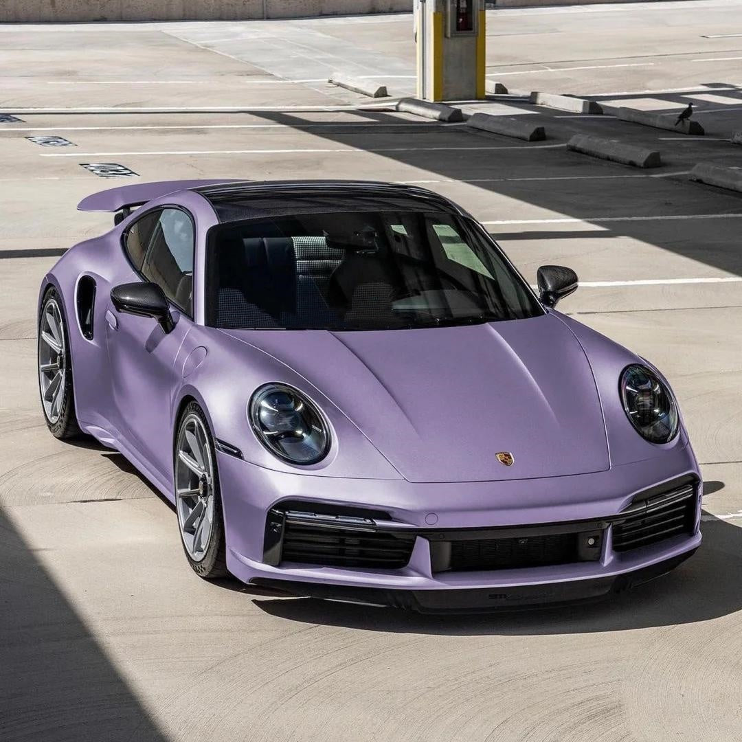 Flawless gloss purple car wrap surface with liquid-smooth depth, highlighting ALUKOCARWRAP zero-orange-peel PET liner.