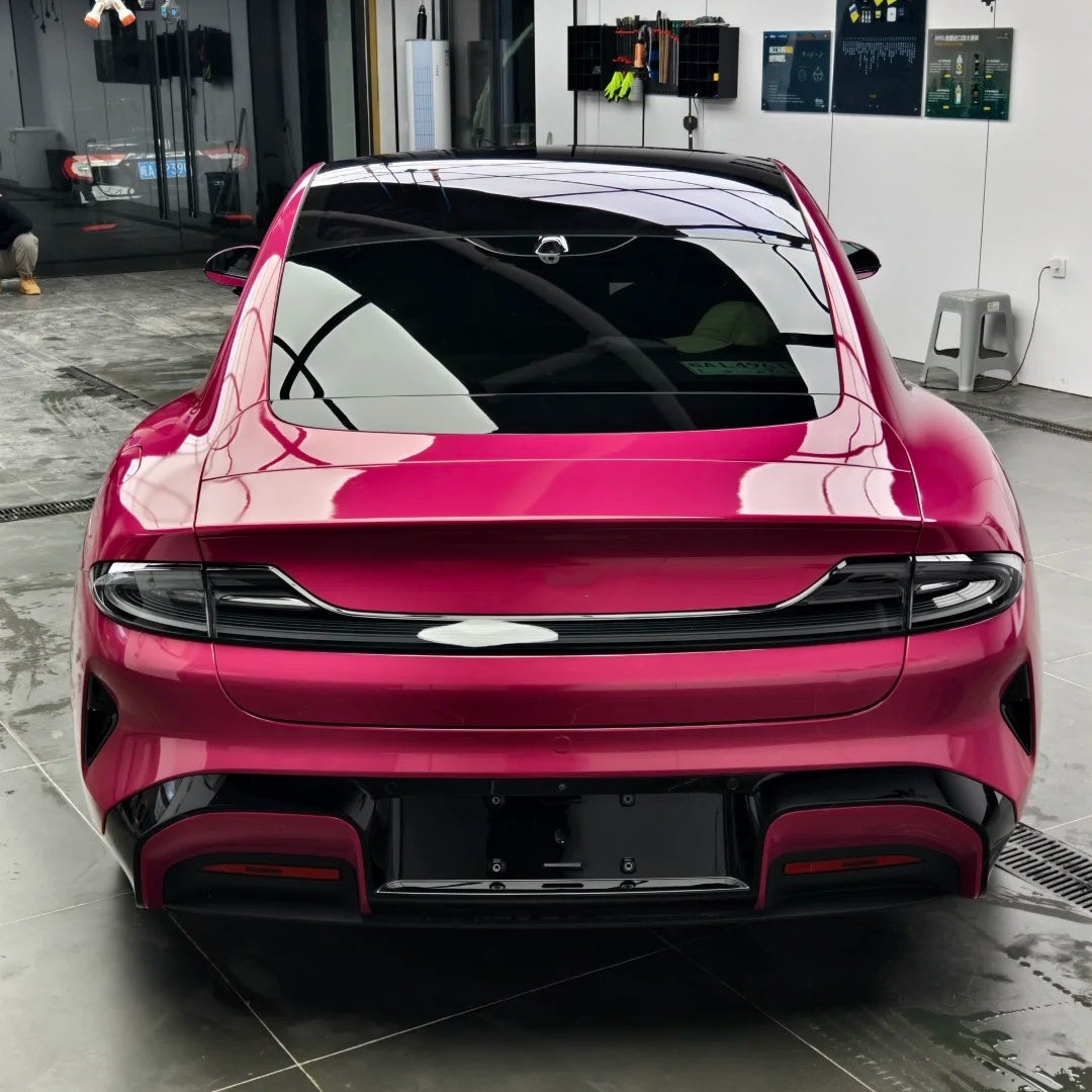 Vibrant mirror-like metallic reflections on a fender wrapped in Gloss Metallic Magenta Red Car Vinyl Wrap PET material.