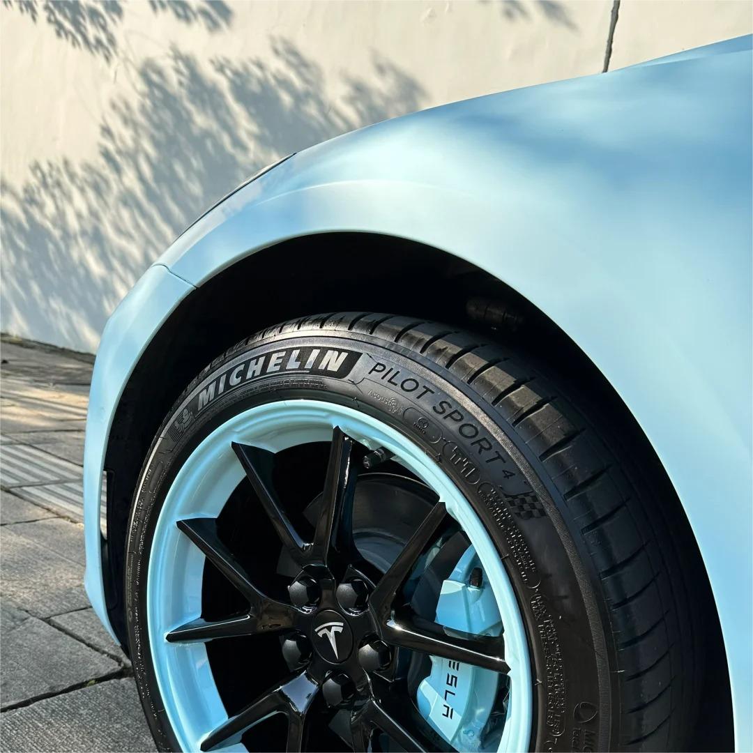 Sharp automotive shoulder lines capturing a shadow-defining, bubble-free application of ALUKOCARWRAP matte satin car wrap matrix without any glare.