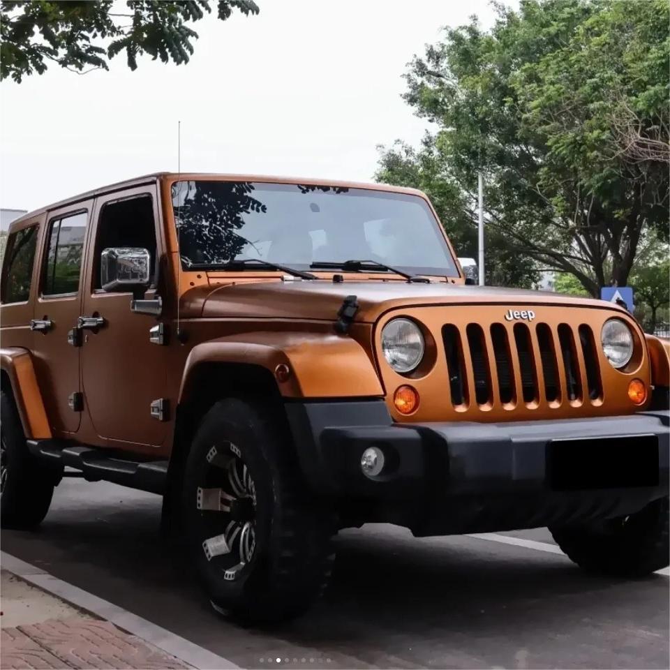 An off-road truck featuring a rugged Matte Metallic Copper Brown Car Vinyl Wrap under dynamic outdoor natural light.